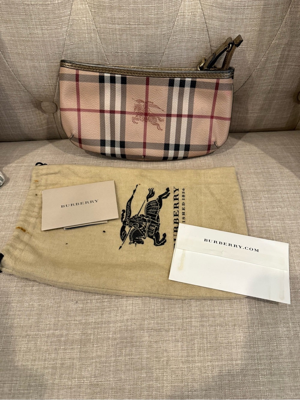Burberry wristlet with gold chain